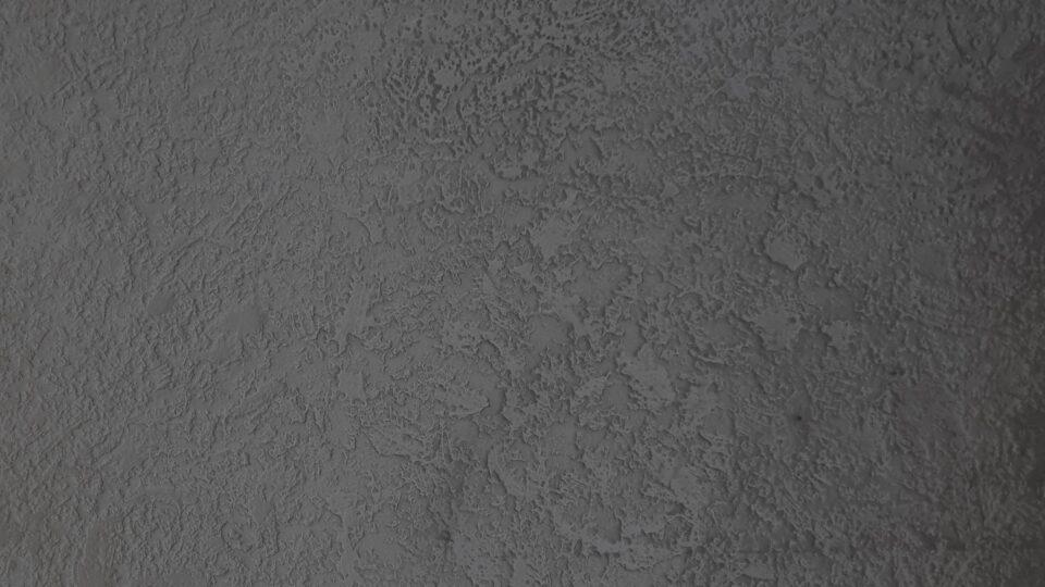 Detail view textured velvet surface in gray lava look