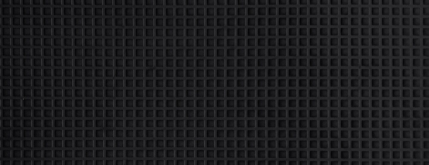 Detail view textured velvet surface with small squares in black