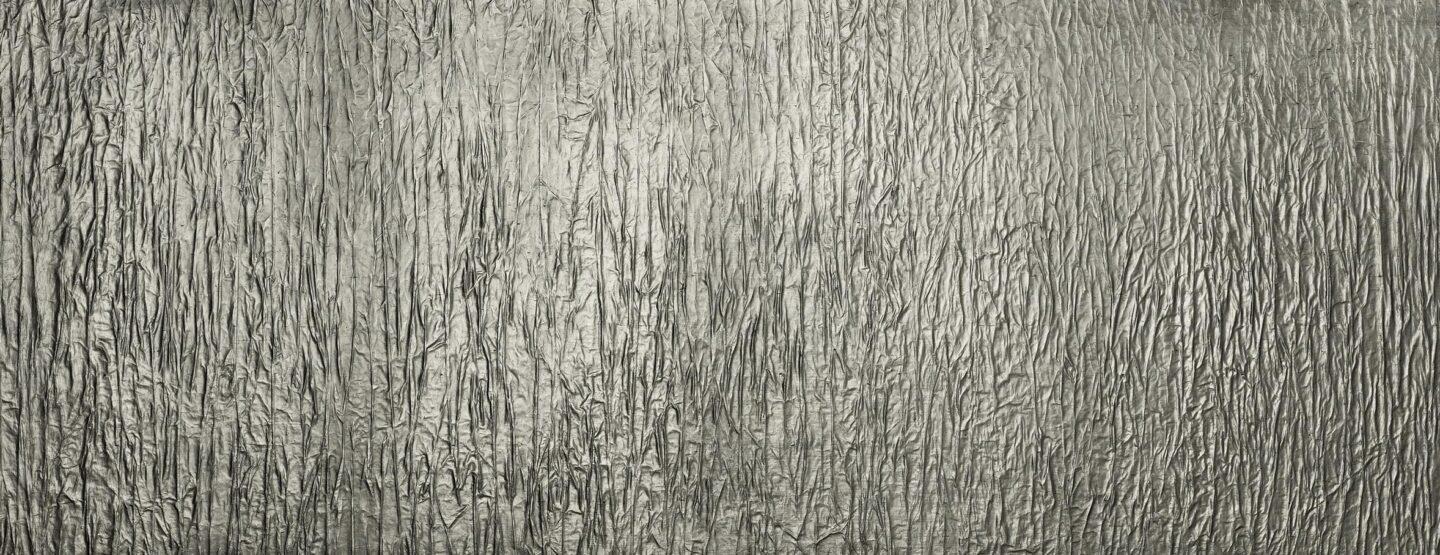 Whole plate photo of gray design plate with deep crumpled texture in vintage look