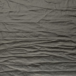 Detail of a gray matte and textured surface in a crinkled look