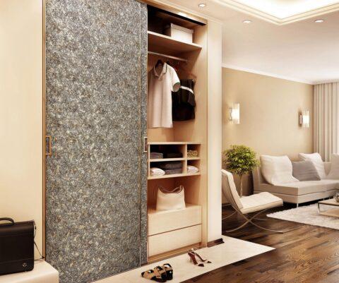 Wall cabinet with textured vintage look decor panel as sliding door inlay.