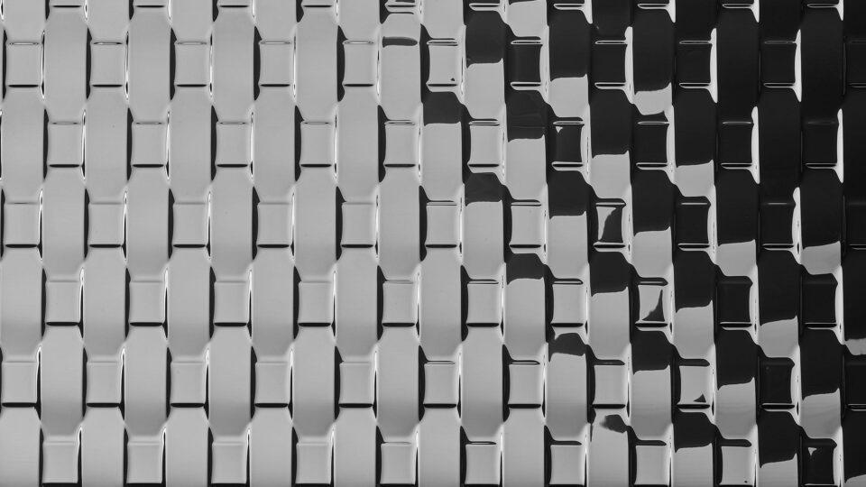 Detail of silver mirrored and textured surface in rattan look