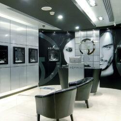 Jewelry store with large presentation areas in silver and black furnishings
