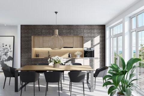 Dining room with dark armchairs and light wooden table, in the background a kitchen with dark gray fronts