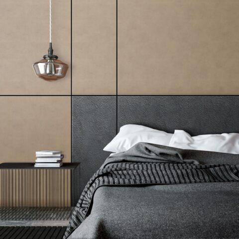 Detail of a bed back wall in black and beige leather