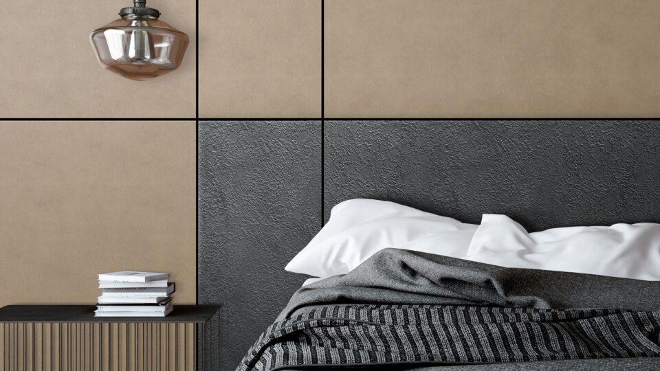Detail of a bed back wall in black and beige leather