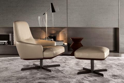 Beige leather seating with dark gray wall in background