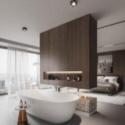 Open bathroom with freestanding bathtub and bedroom separated by a dark wooden wall with integrated fireplace