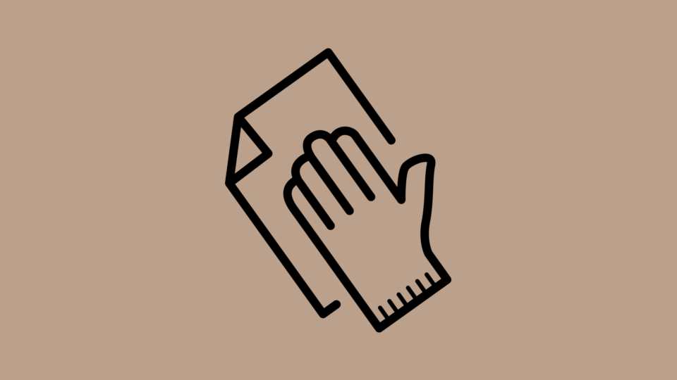 Hand with cloth icon in black on beige background