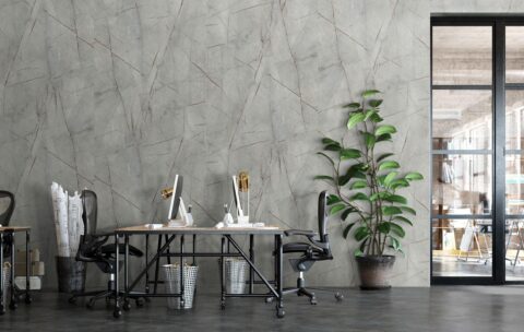 modern open office with stone look wall panels and golden veins