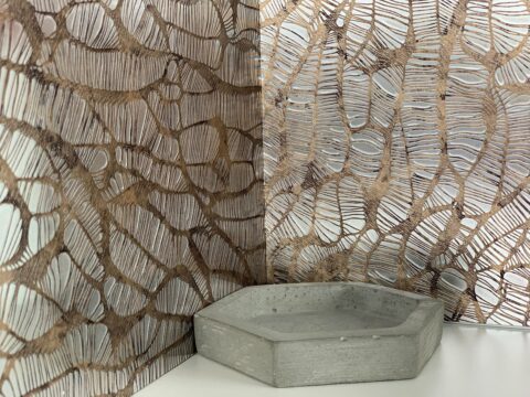 Corner clad with DM MONSOON VINTAGE Brown, in front of it a concrete honeycomb