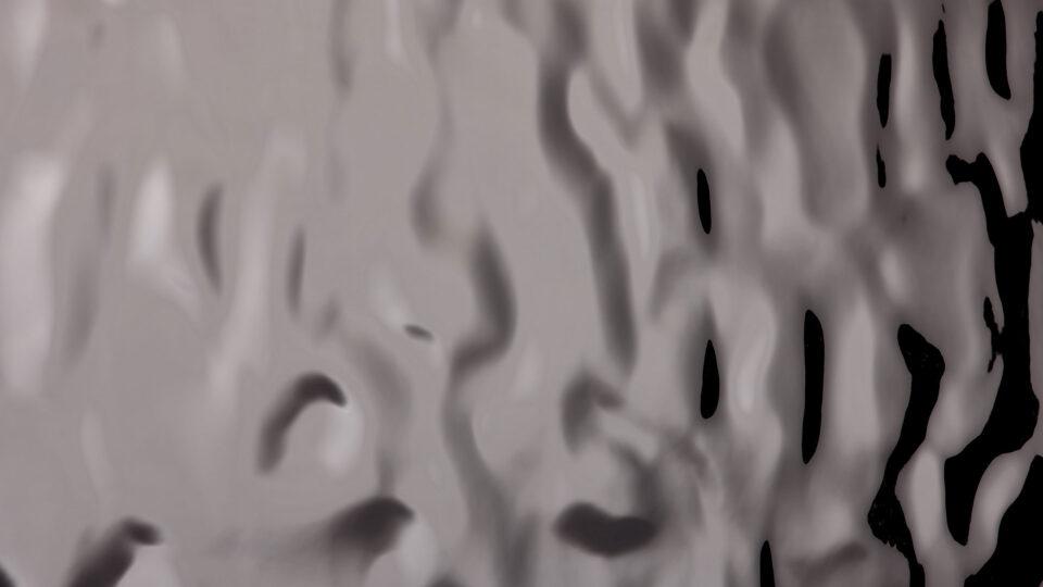 Detail of a grey, glossy decor with structure