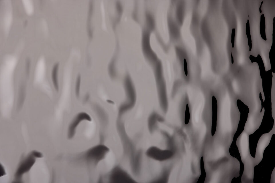 Detail of a grey, glossy decor with structure
