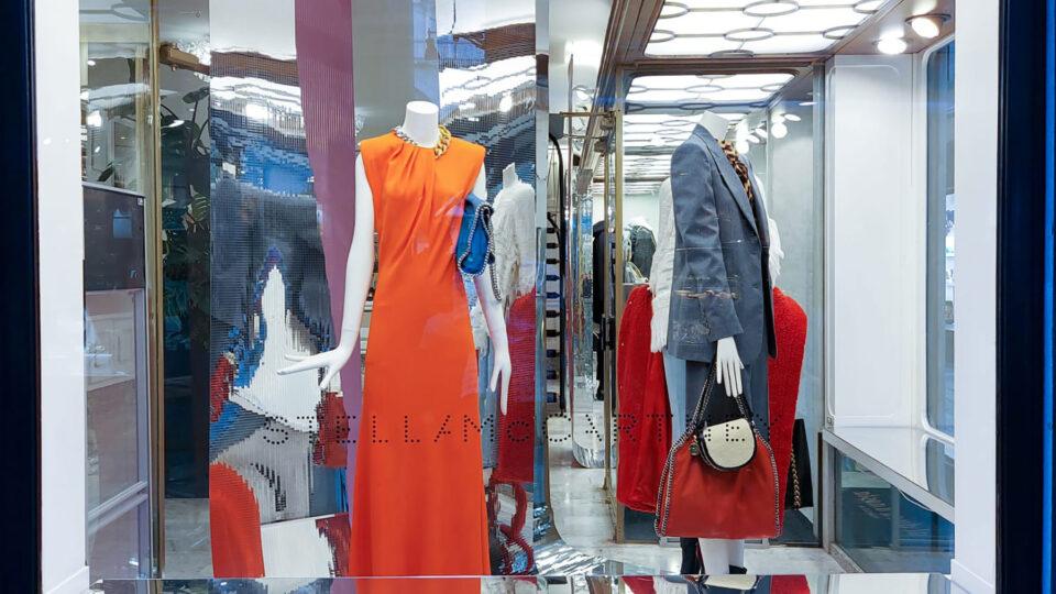 Shop windows with reflective, colourful elements.
