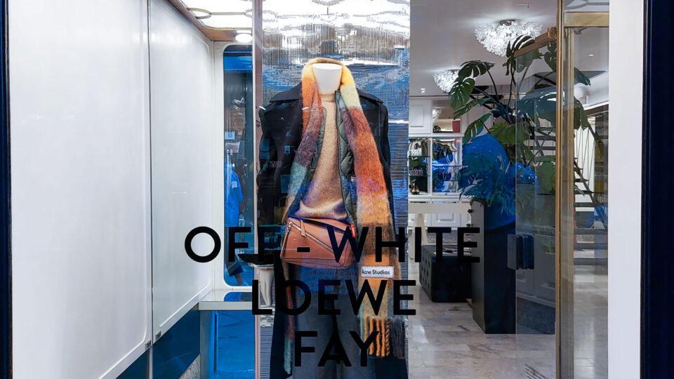 Shop windows with reflective, colourful elements.