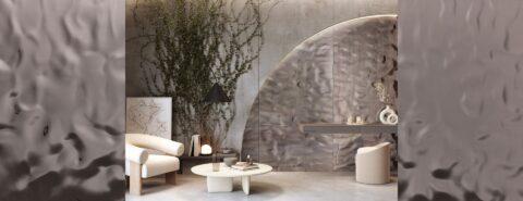 Wellenförmiges, dunkelgraues Dekor in einem Wohnzimmer mit hellen Möbeln