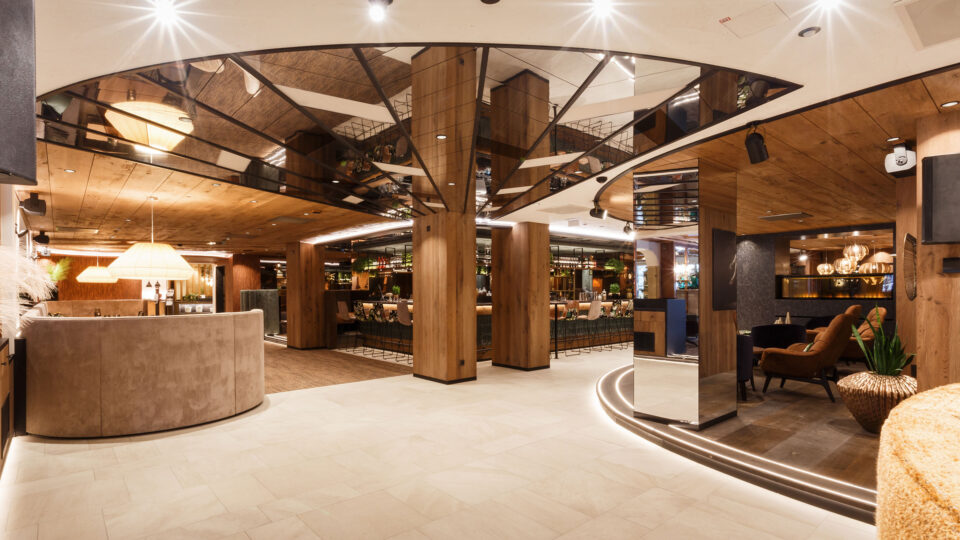 silver-coloured mirror in the modern bar area on the ceiling and wall