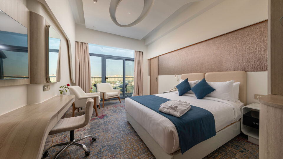 Double bed in a bright hotel room