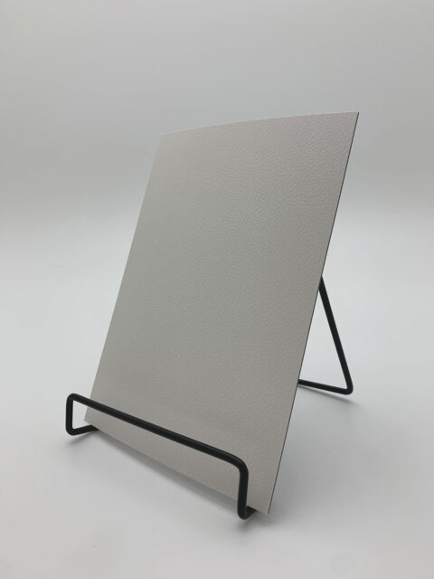 Detail photo of a smooth white leather decor with leather grain