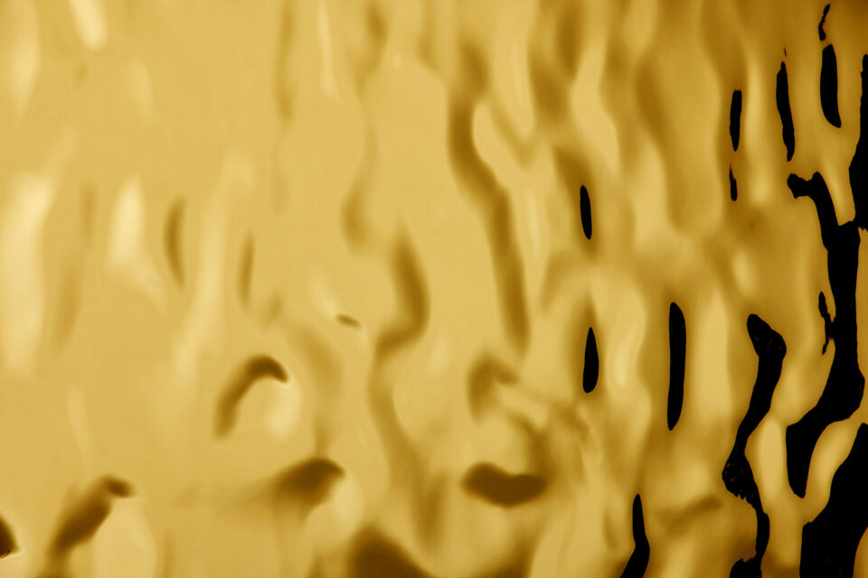 detail photo of a golden reflective decor with structure