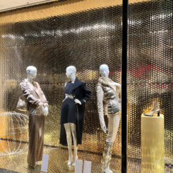 Modern shop window with bright mannequins in ballwear