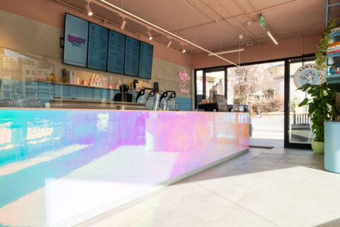 Turquoise-pink reflective counter in restaurant