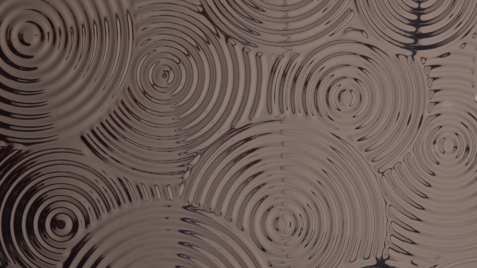 Detailaufnahme eines strukturierten Designpaneels. Die Struktur zeigt verschieden große Kreise die sich hintereinander zeigen und in sich immer kleinere Kreise beinhalten, Die Oberfläche ist spiegelnd und glänzt im Licht. Die Farbe ist Anthracite