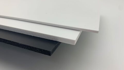 one black and two white panels fanned out