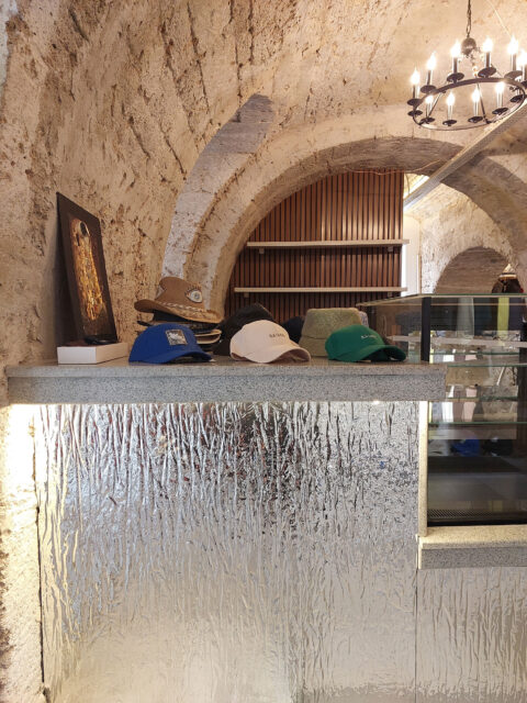 Counter in a jewelry store covered with a deformed mirror