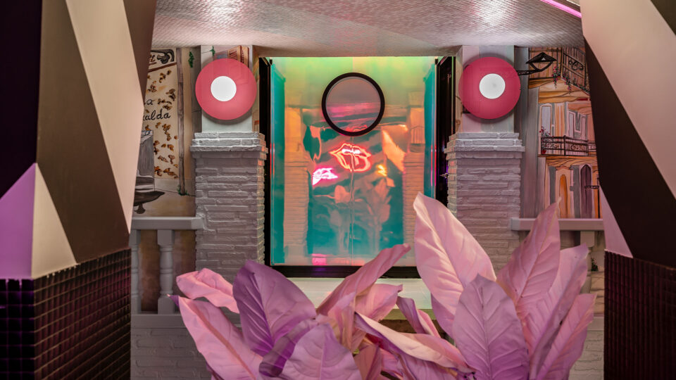 Mirror surface in pink/blue in a club
