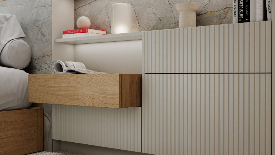 Schlafzimmer modern und hell eingerichtet, im Vordergrund das Nachtkästchen