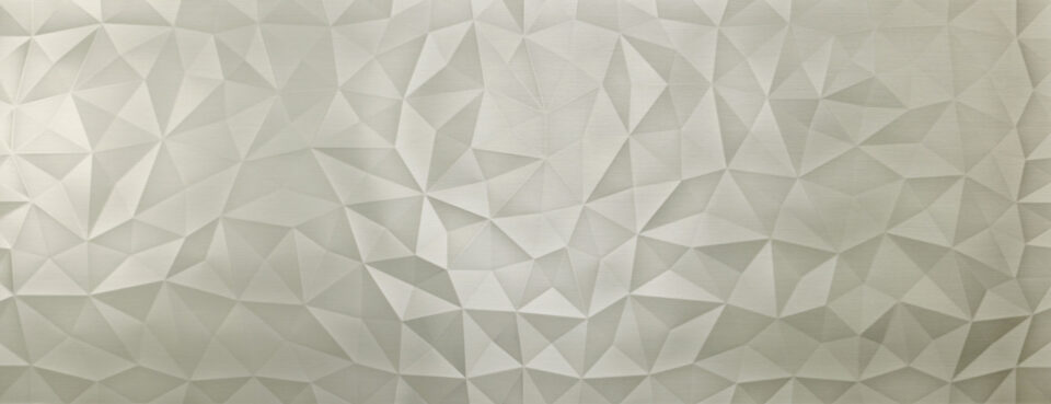 Shown is a photo of a decorative panel. The design features a diamond-like structure, with a steel-colored tone and a brushed surface.