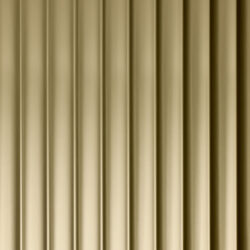 A close-up of a design panel, characterized by wide vertically running lines. The surface is reflective with a gold tone. The varying heights and depths of the structure create a particularly deep effect that fascinates.
