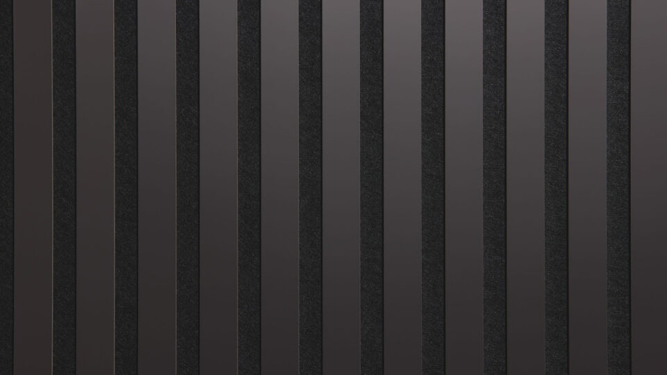 Detailed shot of a sound-absorbing acoustic panel. The surface is black and features elegant, reflective anthracite stripes.