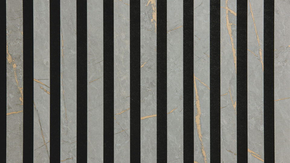 Detailed shot of a sound-absorbing acoustic panel. The surface is black and features elegant, grayish stripes interspersed with golden veins.