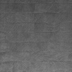 Detailed shot of a grayish designer panel with a checkered texture. The surface is made of velvet.