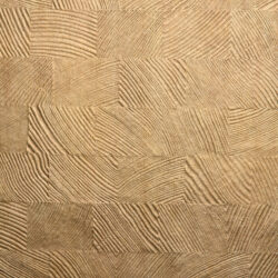 Detailed shot of a sandy-metallic design panel made of synthetic leather. The structure is structured and checkered.