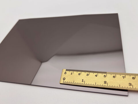 Detailed shot of the SL FACET Anthracite design panel with a ruler