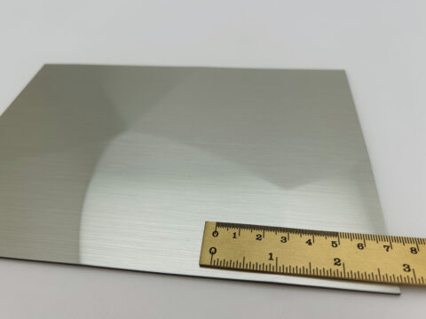 Detailed shot with ruler of the SL FACET Green Steel brushed design panel