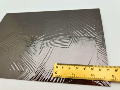 Detailaufnahme mit Lineal, des Designpaneels SL GRAIN Anthracite.