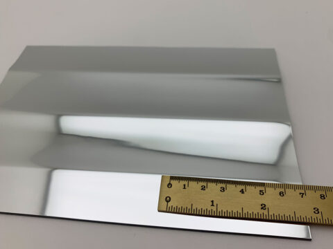 Detailed shot with ruler of the SL PILLAR Silver design plate.