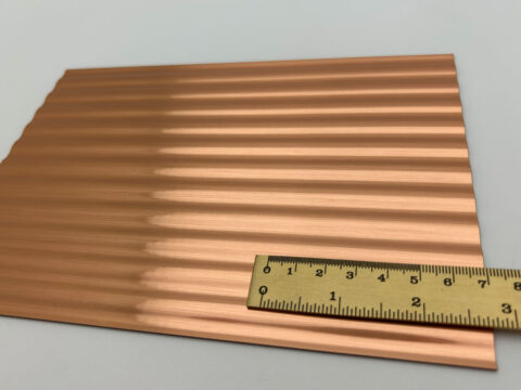 Detailed shot with ruler of the SL WAVE 12 Copper brushed design panel.