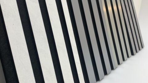 Side view of various acoustic panels arranged in a row.