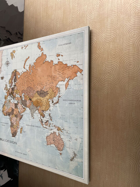 World map on a textured gold background